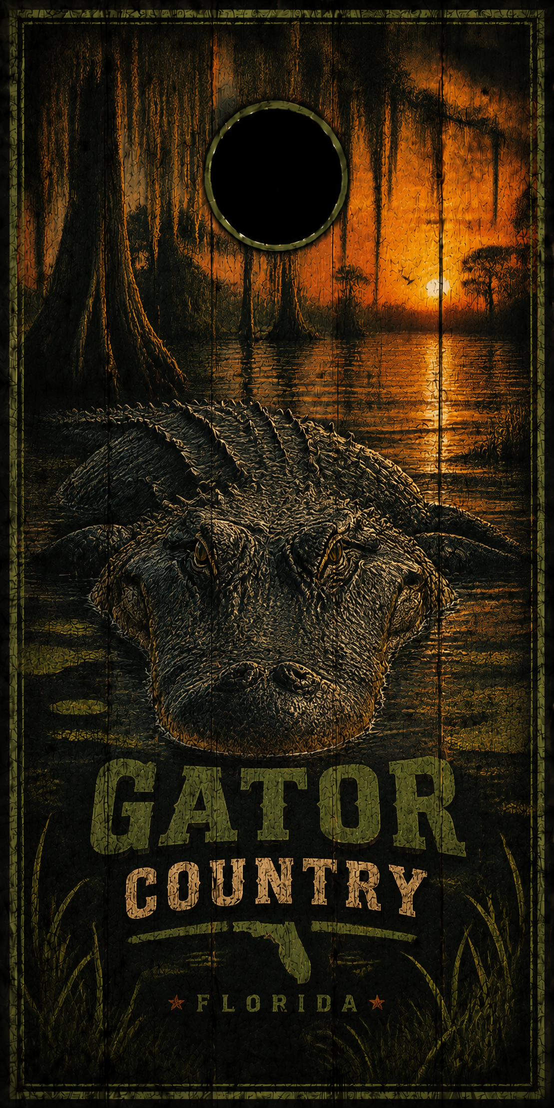 A rectangular cornhole board with a Florida gator swamp scene, featuring a large alligator head, trees, water, and sunset glow. The text 'GATOR COUNTRY' and 'FLORIDA' are printed on the board, with a circular hole near the top center.